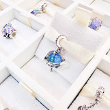 Cargar imagen en la galería, Charm Planeta Tornasol Azul